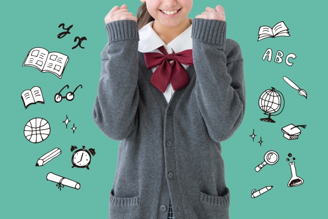 ガッツポーズをする女子生徒